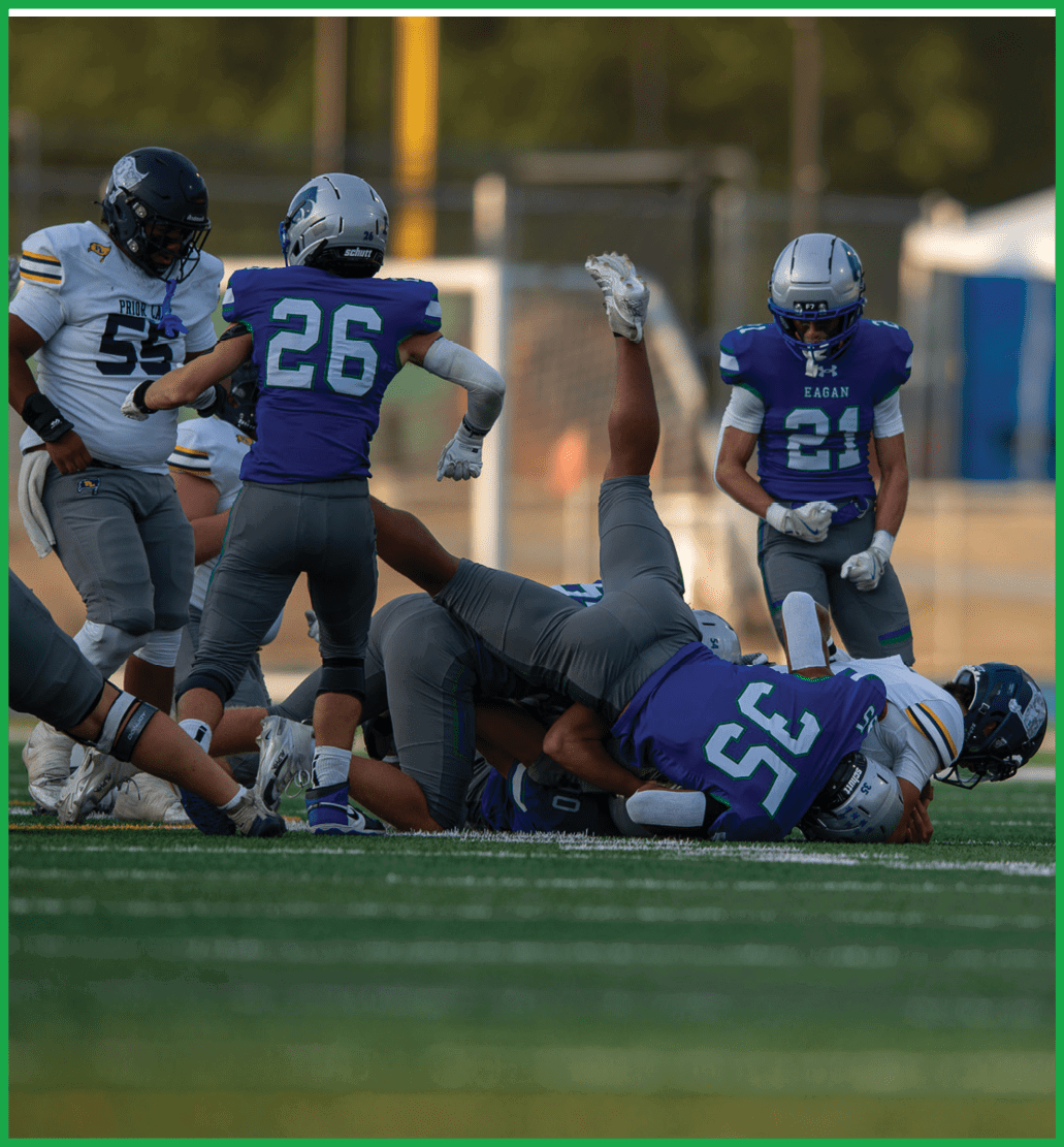 A football player running on the field. Description generated by AI