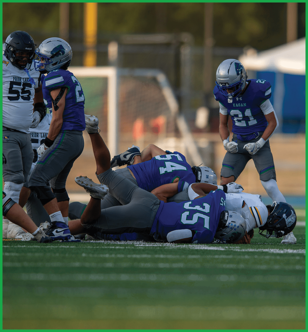 A football player running on the field. Description generated by AI