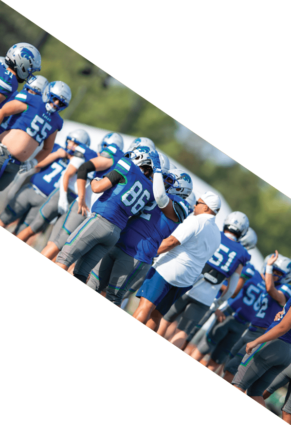 A group of young men wearing black and white uniforms are standing on a field. AI generated content