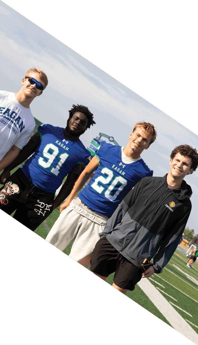 A football team is gathered around a coach, listening to his instructions. AI generated content