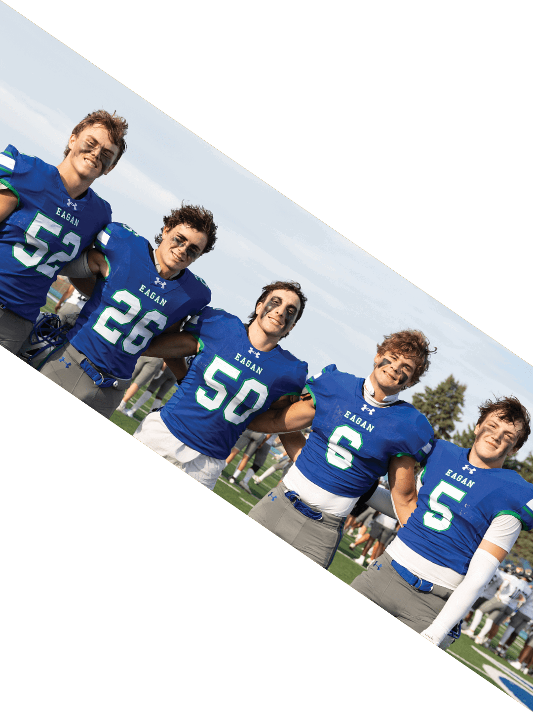 A group of people wearing black jerseys are huddled together on a field. AI generated content