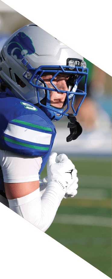 A football player wearing a white jersey with the number 86 catches a football in the air. AI generated content