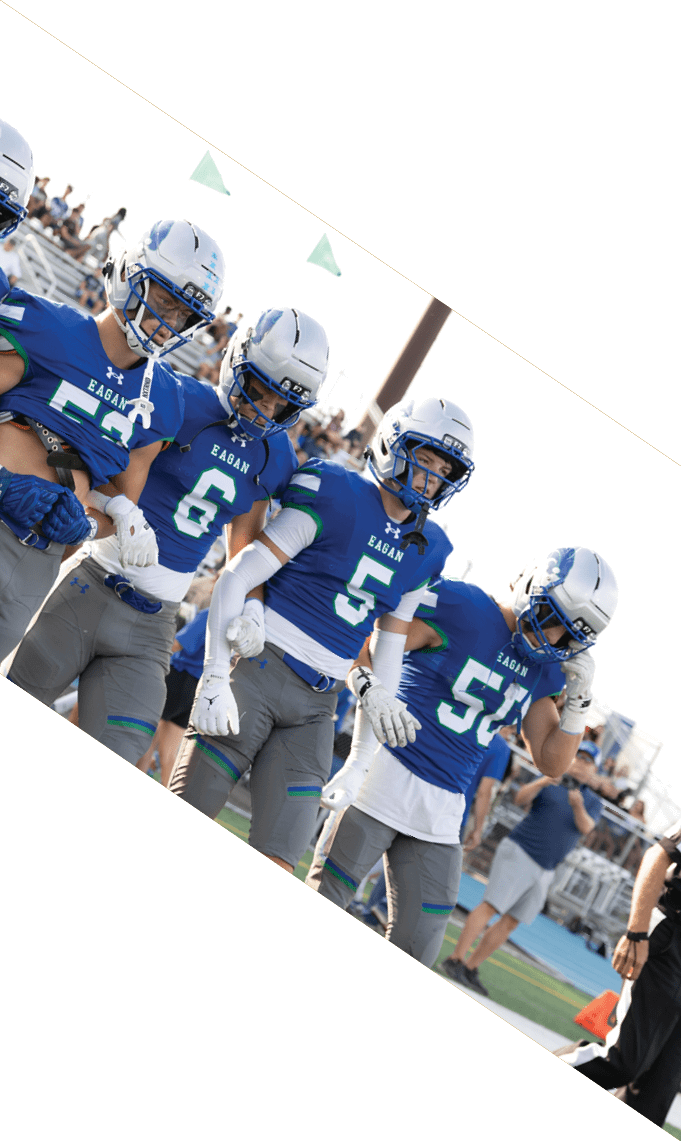 A group of football players pose for a picture. AI generated content