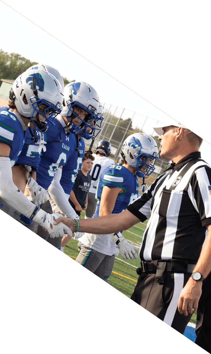 Three men wearing football uniforms are posing for a picture. AI generated content