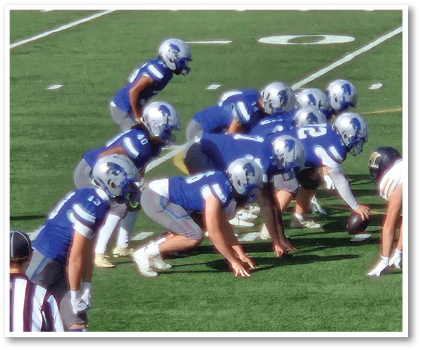 A group of football players wearing black jerseys with the number 3 on them. Description generated by AI