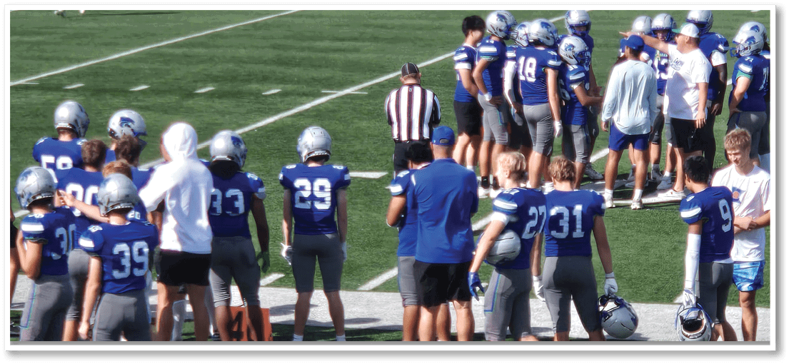 A football player is kicking a football on a field. Description generated by AI