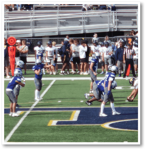 Two football players wearing black jerseys with the number 11 on them. Description generated by AI