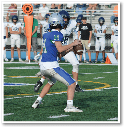 Two football players wearing black jerseys with the number 11 on them. Description generated by AI
