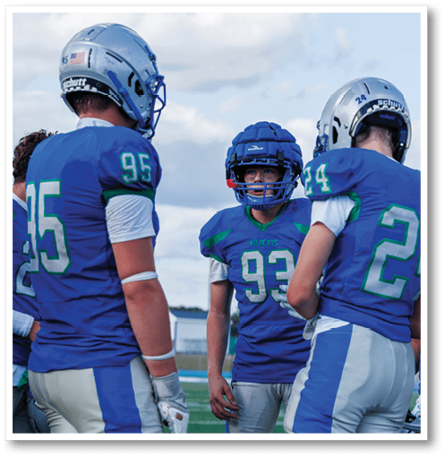 Two football players wearing black jerseys with the number 11 on them. Description generated by AI
