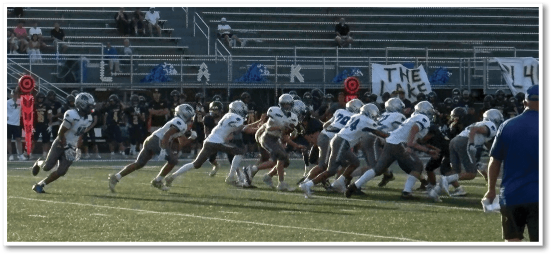 A football player running on the field. Description generated by AI