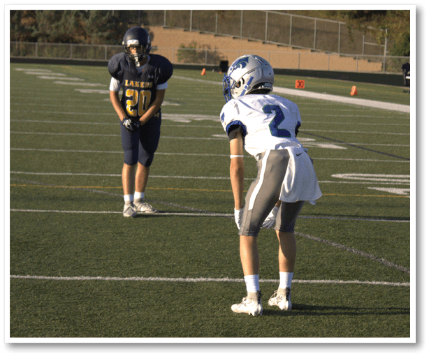 A football player is kicking a football on a field. Description generated by AI
