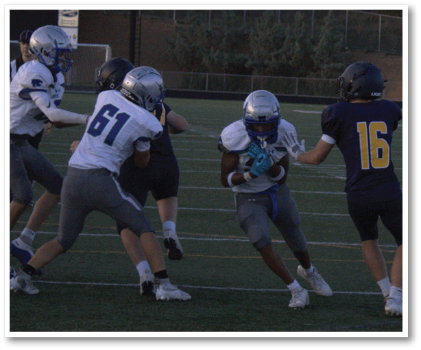 A group of football players wearing black jerseys with the number 3 on them. Description generated by AI