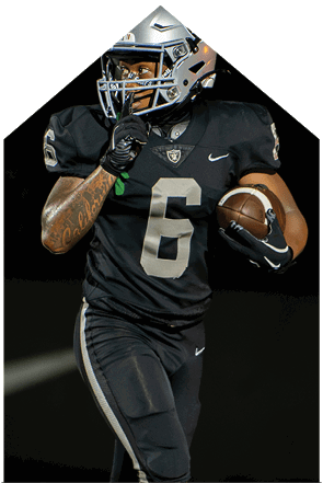 A young man wearing a white jersey with the number 10 on it. Description generated by AI