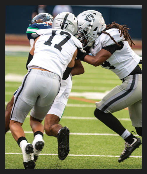 A football player in a white uniform is running with a football in his hand. AI generated content