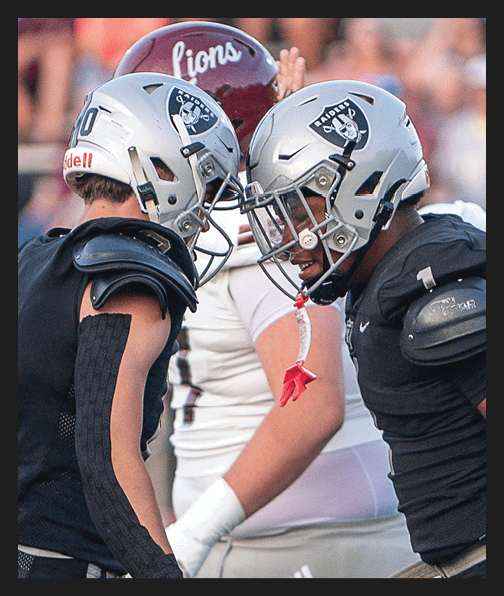 A football player in a white uniform is running with a football in his hand. AI generated content