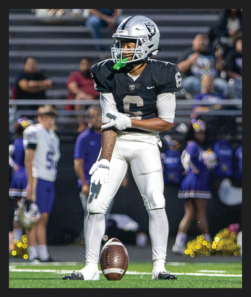 A football player in a white uniform is running with a football in his hand. AI generated content