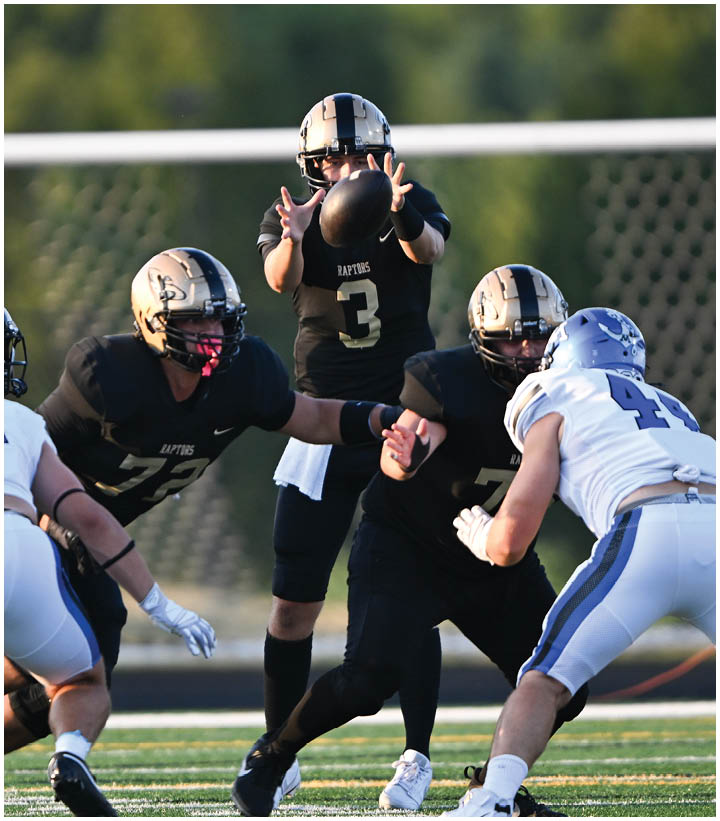A group of football players wearing black and white uniforms. Description generated by AI