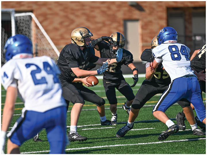 A football player is sliding on the ground. Description generated by AI