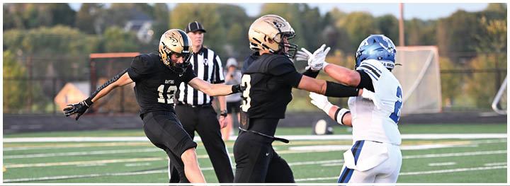 A football player is sliding on the ground. Description generated by AI