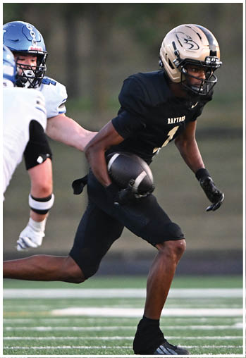 A football player running on the field. Description generated by AI