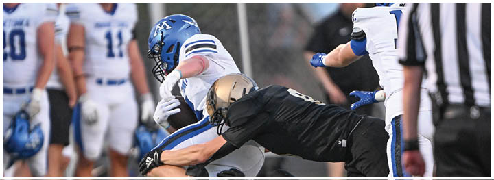 A football player is sliding on the ground. Description generated by AI