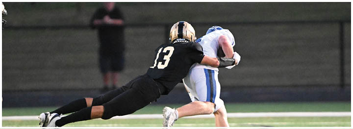 A football player is sliding on the ground. Description generated by AI