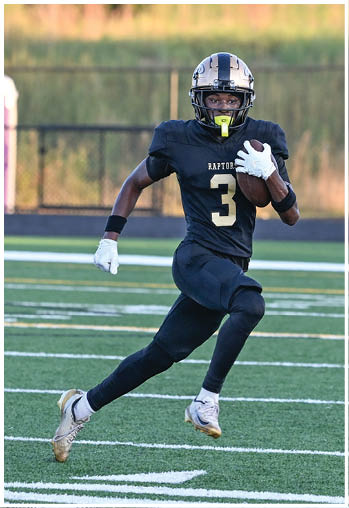 A football player running on the field. Description generated by AI