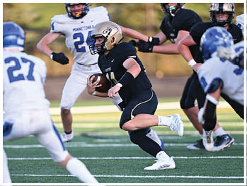 A football player running on the field. Description generated by AI
