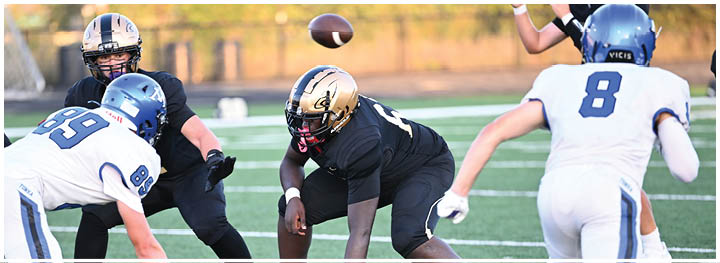 A football player is sliding on the ground. Description generated by AI