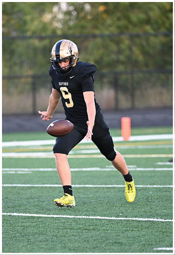 A football player running on the field. Description generated by AI