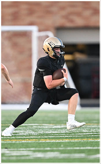 A football player running on the field. Description generated by AI