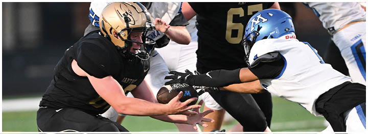 A football player is sliding on the ground. Description generated by AI