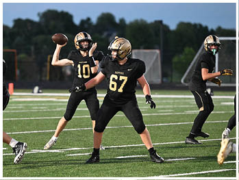 A football player running on the field. Description generated by AI