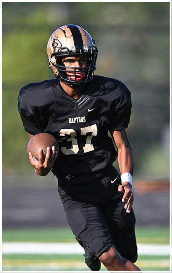 A football player running on the field. Description generated by AI