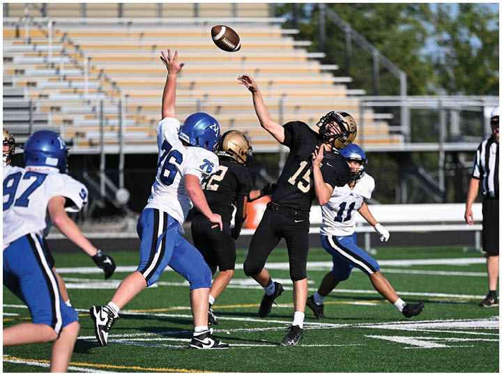 A football player is sliding on the ground. Description generated by AI