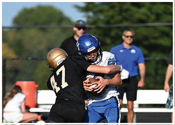 A football player running on the field. Description generated by AI