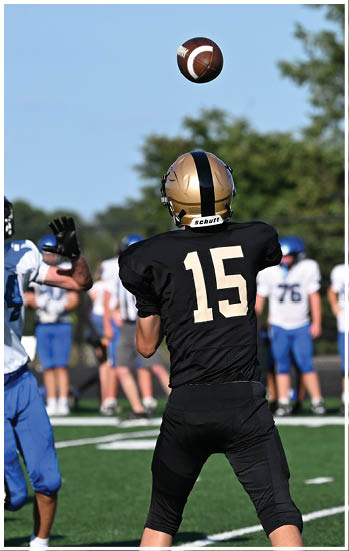A football player running on the field. Description generated by AI