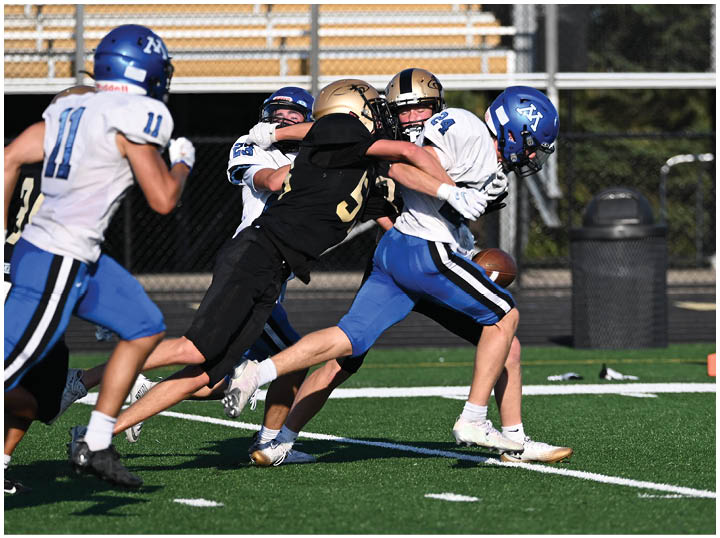 A football player is sliding on the ground. Description generated by AI