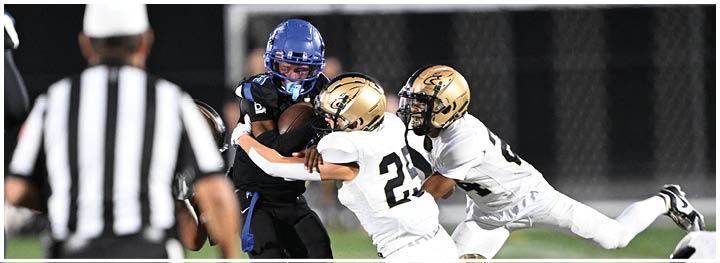 A football player is sliding on the ground. Description generated by AI