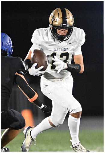 A football player running on the field. Description generated by AI