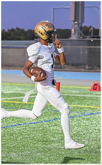 A football player running on the field. Description generated by AI