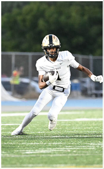 A football player running on the field. Description generated by AI