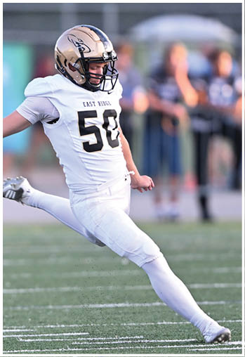 A football player running on the field. Description generated by AI