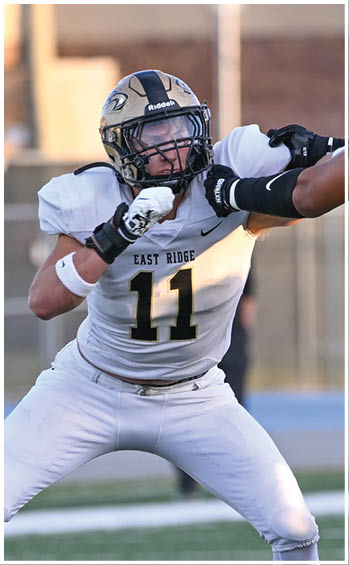 A football player running on the field. Description generated by AI