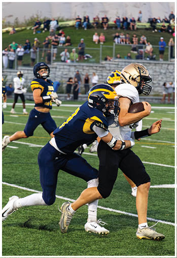 A football player running on the field. Description generated by AI