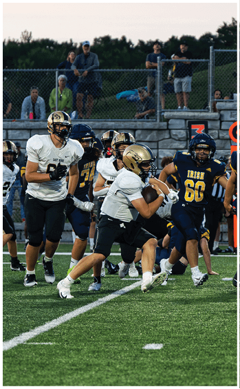 A football player running on the field. Description generated by AI