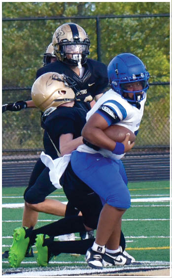 A football player running on the field. Description generated by AI