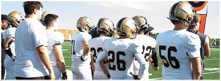 A football player is sliding on the ground. Description generated by AI