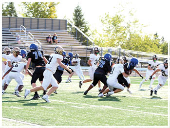 A football player running on the field. Description generated by AI