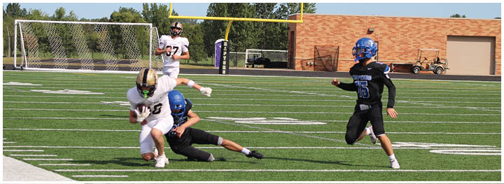 A football player is sliding on the ground. Description generated by AI